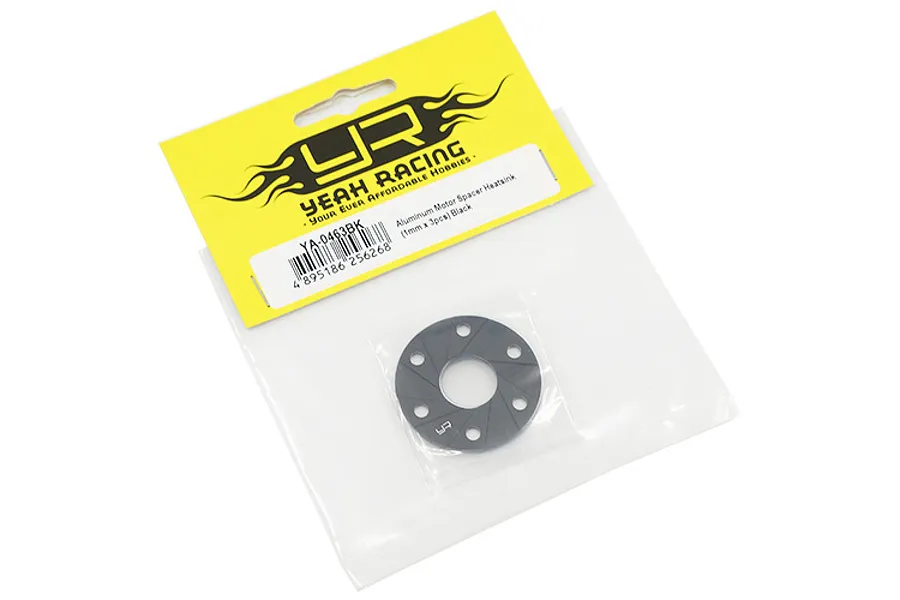 A single black aluminium motor spacer heatsink from Yeah Racing in its original yellow and clear plastic retail packaging.