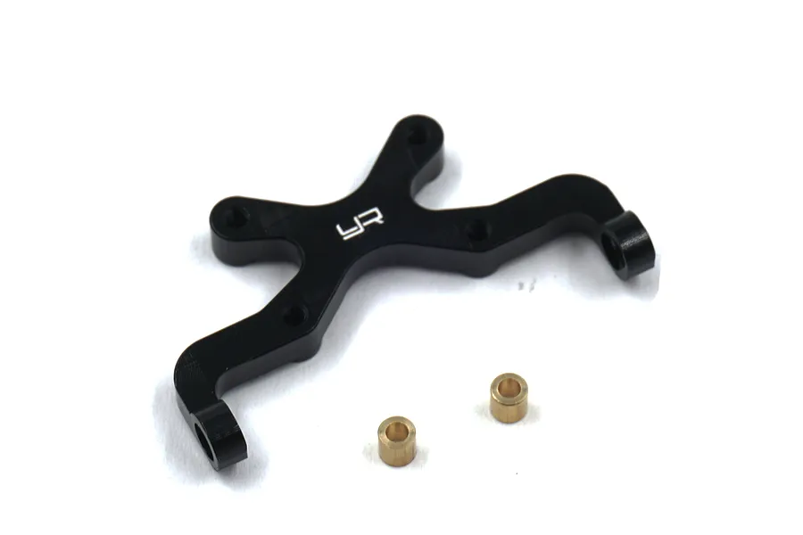 A black anodized aluminium rear body mount for RC cars by Yeah Racing, shown with two small brass bushings on a white background.