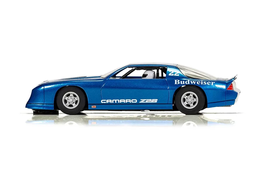 Side profile of a blue Scalextric 1/32 scale Chevrolet Camaro Z28 slot car with Budweiser branding and number 22 on a white background.