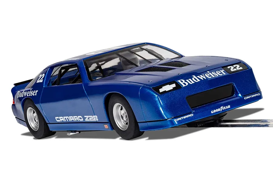 A blue Scalextric 1/32 scale Chevrolet Camaro IROC-Z slot car with Budweiser livery and number 22 on a track.