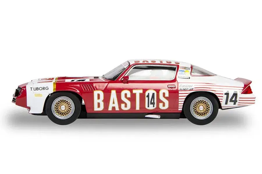 Side profile of a 1/32 scale Scalextric Chevrolet Camaro Z28 slot car in red and white Bastos livery with number 14.