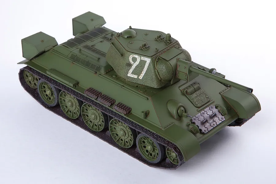 A 1/35 scale plastic model of a Soviet T-34/76 tank painted in olive green with the number 27 on the turret, set against a plain white background.