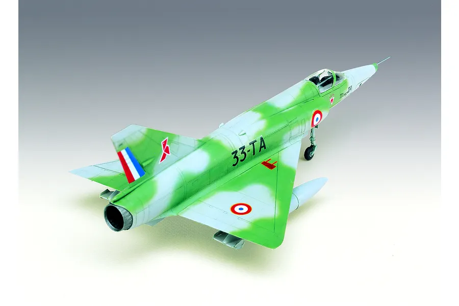 A completed 1/48 scale plastic model of a French Mirage III R fighter jet with green and light grey camouflage paint and French Air Force markings.