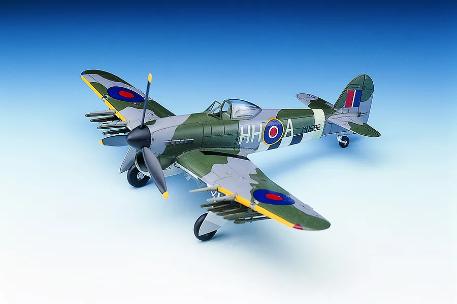 A completed 1/72 scale plastic model kit of a Hawker Typhoon Mk.IB fighter plane, featuring green and grey camouflage and RAF markings.