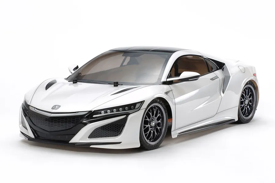 A 1/10 scale Tamiya TT-02 RC car featuring a white Honda NSX body shell on a white background.