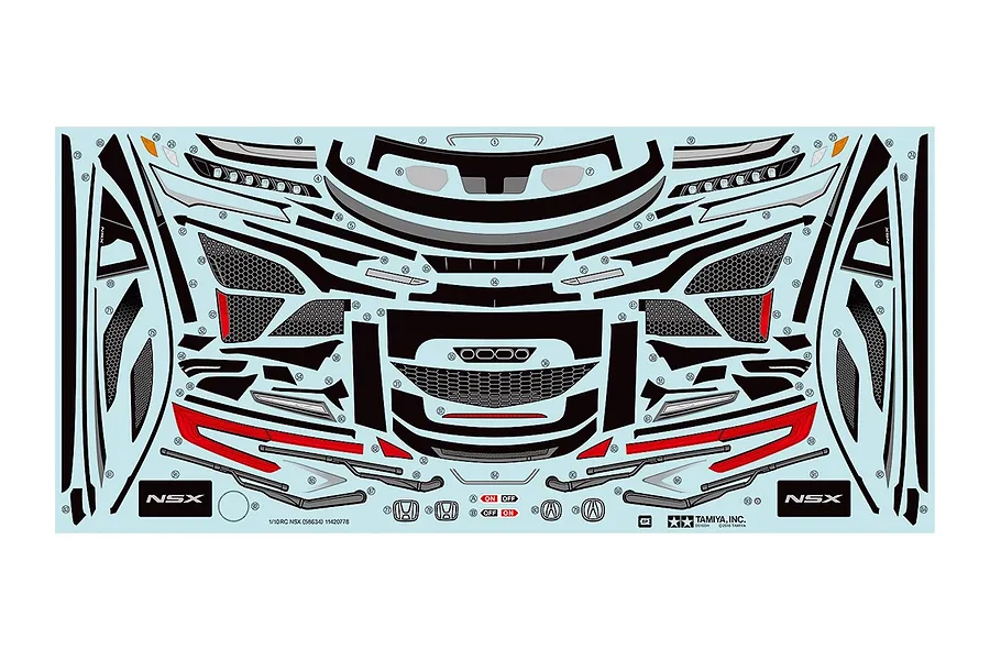 A Tamiya decal sheet for the 1/10 scale NSX RC car, featuring various body trim, light, and logo stickers on a light blue backing.