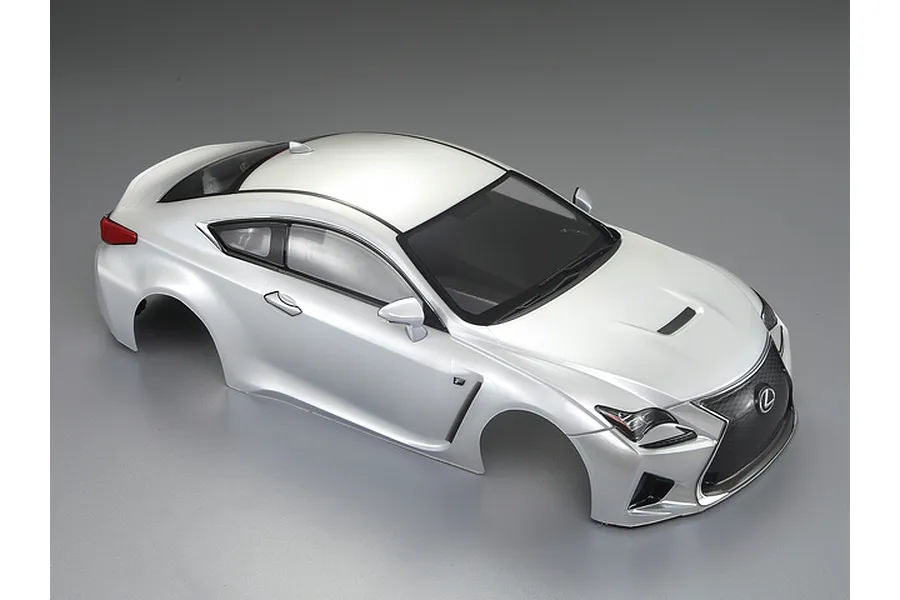 A pearl white pre-painted 1/10 scale Lexus RC F RC car body shell viewed from a high angle against a grey background.