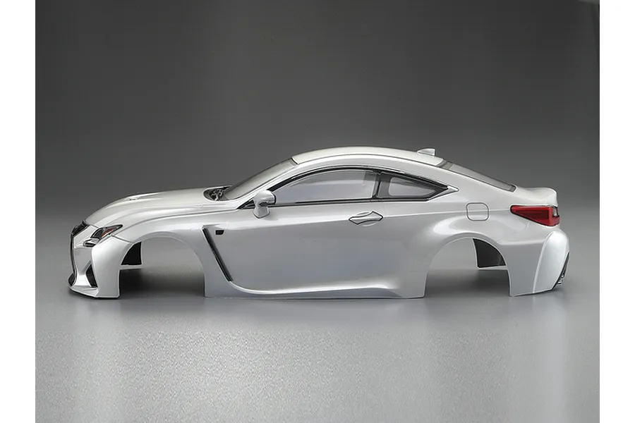 Side view of a pearl white Killerbody 1/10 scale Lexus RC F RC car body shell on a grey background.