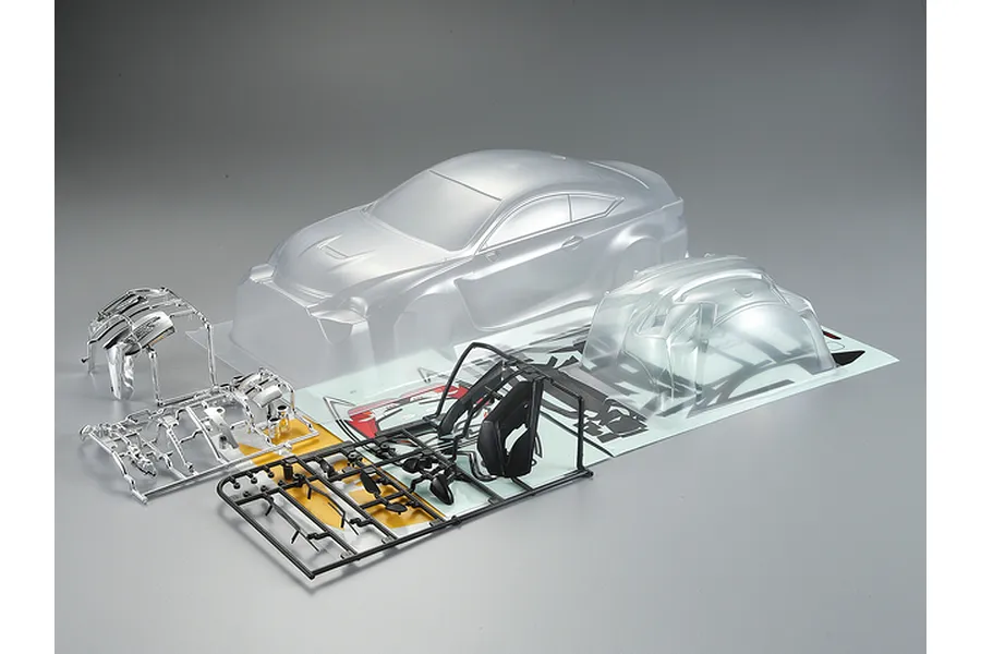 Killerbody 1/10 Lexus RC F clear unpainted RC car body shell kit with plastic parts and decals on a grey background.