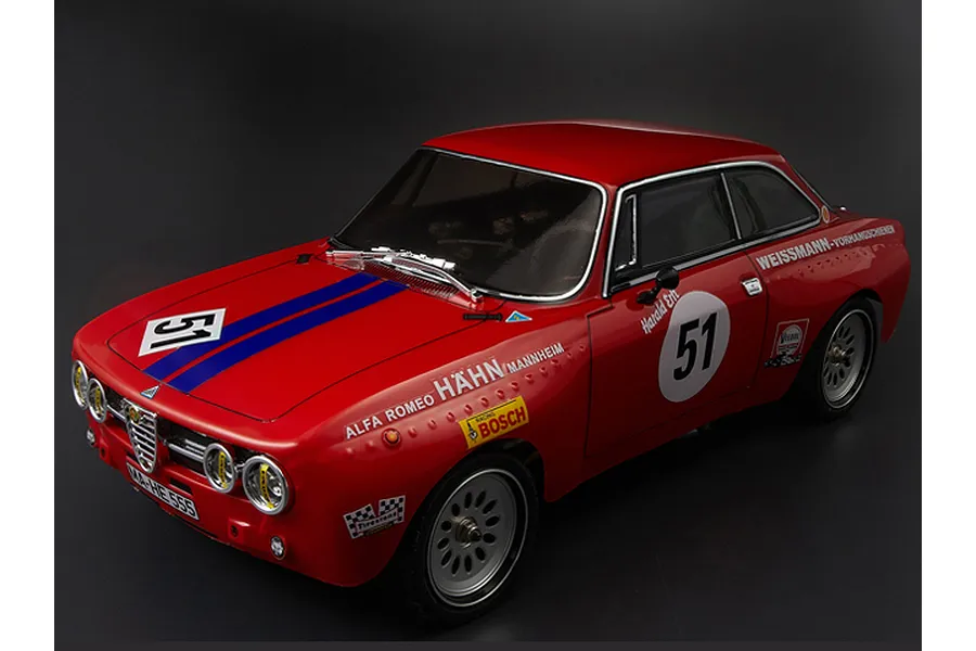 A 1/10 scale red Alfa Romeo 2000 GTAm RC car body shell with racing decals, number 51, and blue stripes on a dark background.