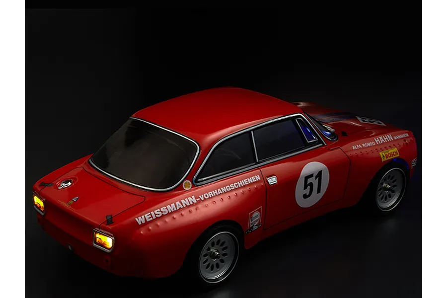 Killerbody 1/10 scale Alfa Romeo 2000 GTAm RC car body shell in red with racing decals and illuminated tail lights on a black background.