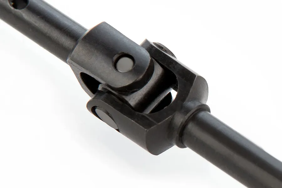 Close-up of a black metal universal joint drive shaft for an RC vehicle.