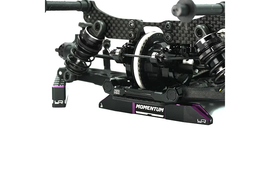 Yeah Racing Momentum aluminium droop gauge support blocks in black and purple installed under an RC car chassis.