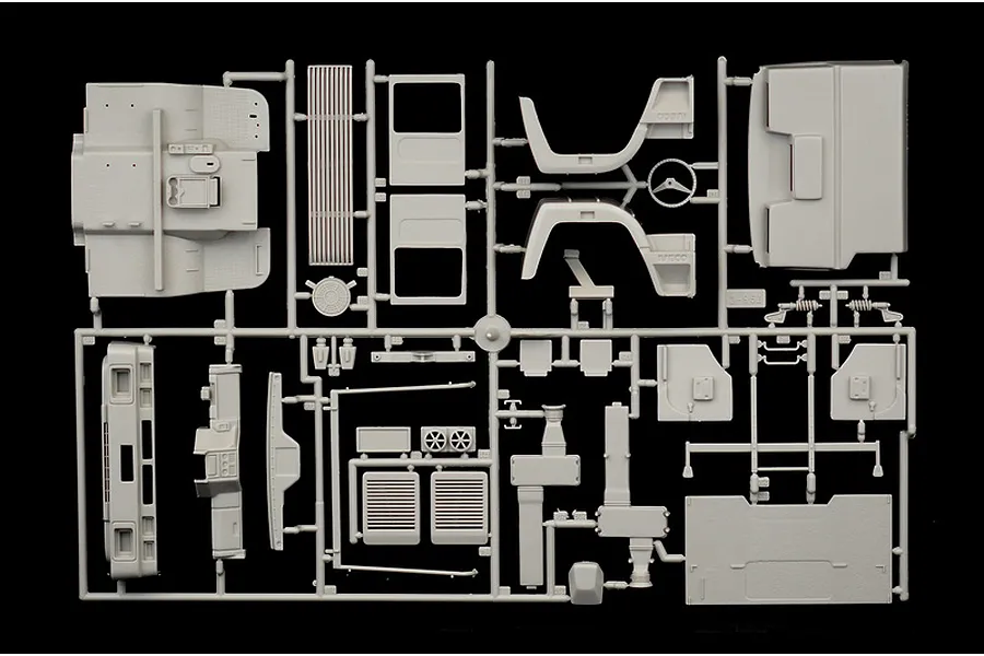 A grey plastic sprue containing various unpainted model truck parts for an Italeri 1/24 scale Iveco Turbostar model kit.