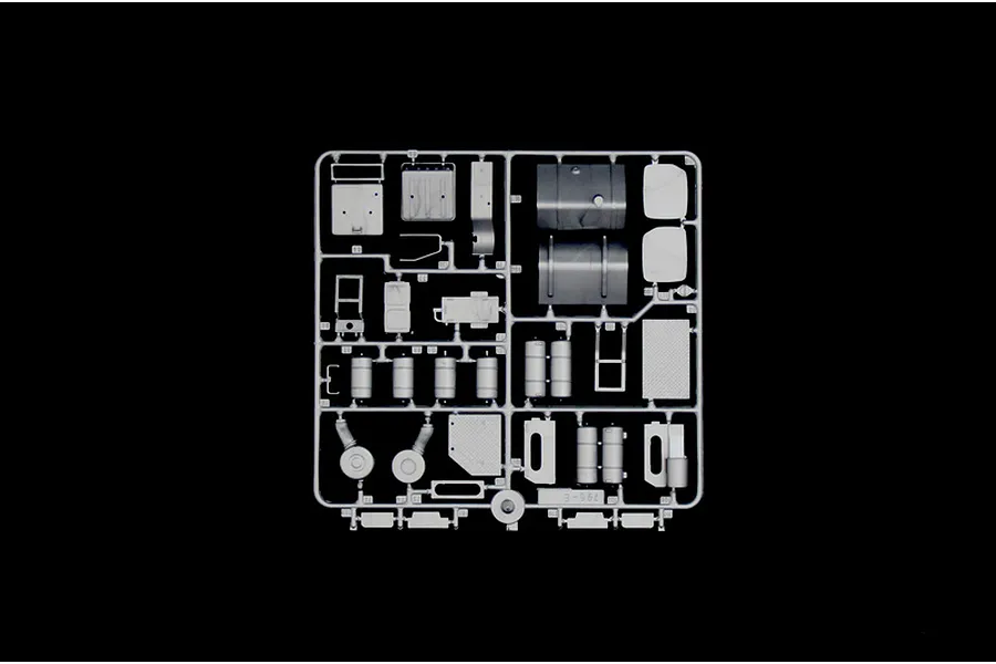 A grey plastic sprue containing various model truck parts for an Italeri 1/24 scale kit, isolated against a black background.