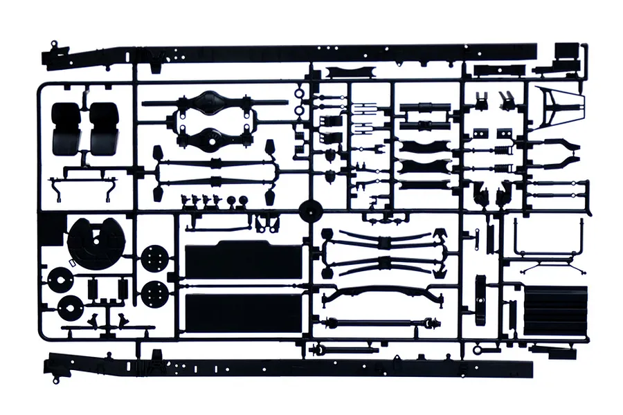 A black plastic sprue containing various model truck parts for an Italeri 1/24 scale Iveco Turbostar kit, including chassis rails, suspension, and interior components.