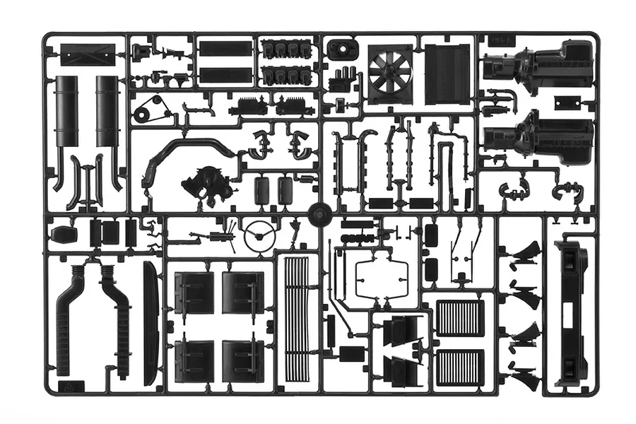 A black plastic sprue containing various unpainted model truck parts for an Italeri 1/24 scale Iveco Turbostar model kit.