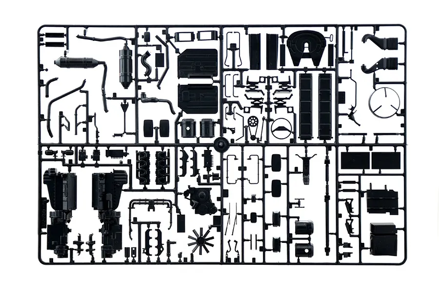 A black plastic sprue containing various unattached model truck parts for an Italeri 1/24 scale Scania model kit.