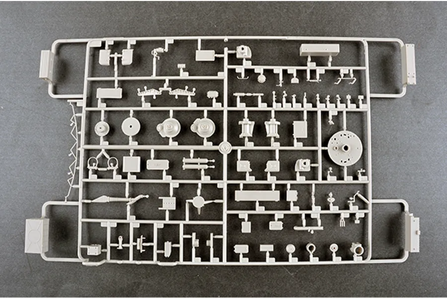 A light grey plastic model kit sprue containing various small parts for a 1/35 scale military vehicle model, viewed from directly above.