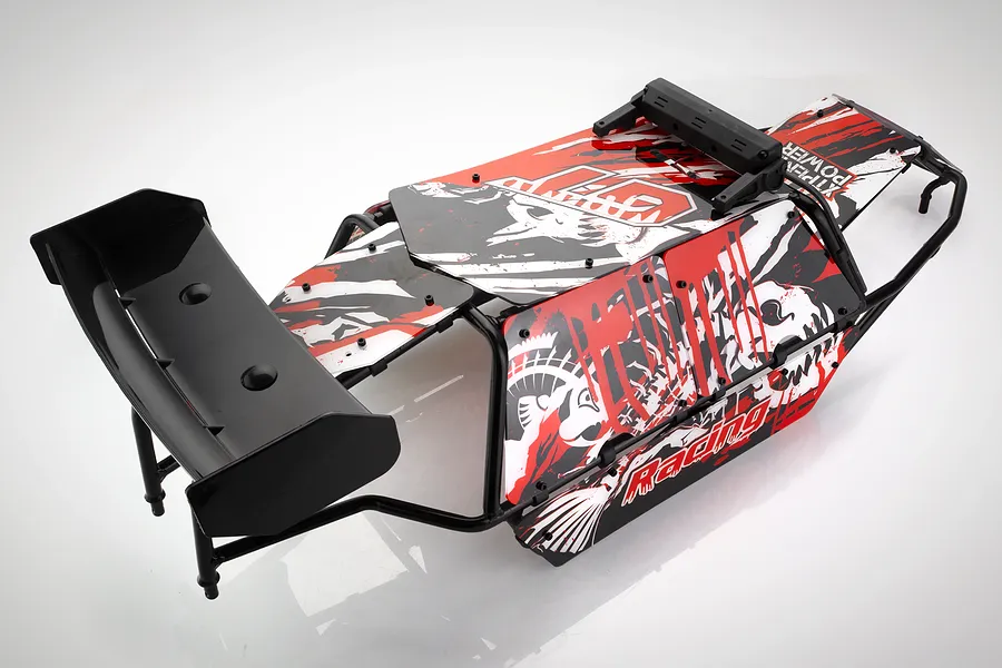 Rovan black steel roll cage for RC Baja buggy with red, white, and black patterned body panels, rear wing, and LED light bar housing.