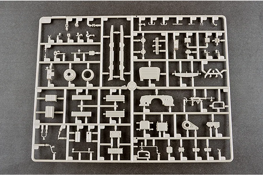 A grey plastic model kit sprue containing various small parts for a 1/35 scale military vehicle model.