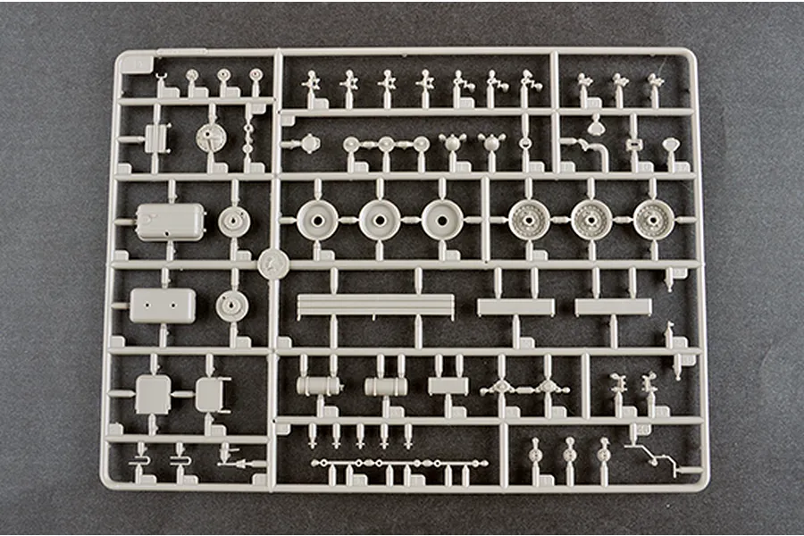 A grey plastic sprue containing various unpainted model parts for a 1/35 scale military vehicle kit.