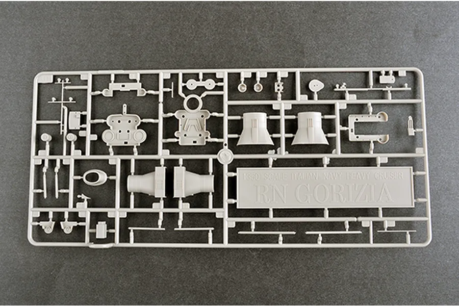 A grey plastic model kit sprue for the 1/350 scale Italian Heavy Cruiser RN Gorizia, featuring various ship parts and a nameplate.