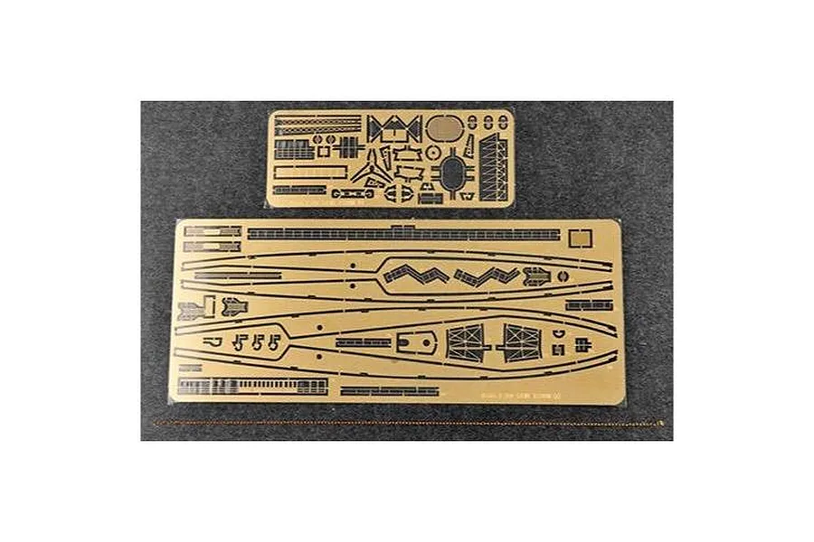 Two photo-etched brass detail sheets and a length of metal chain for a 1/350 scale model kit, laid out on a dark grey surface.