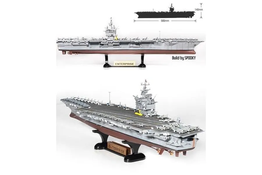Two views of a completed 1/600 scale plastic model kit of the USS Enterprise CVN-65 aircraft carrier on a display stand.