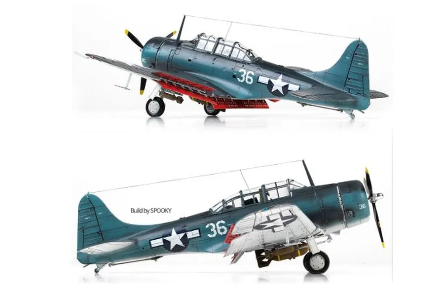 Two side views of a finished 1/48 scale model of a USN SBD-5 Dauntless dive bomber, painted in dark blue with white markings and red dive brakes.