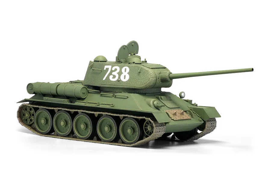 A 1/35 scale plastic model of a Soviet T-34/85 tank painted in olive green with the number 738 on the turret.