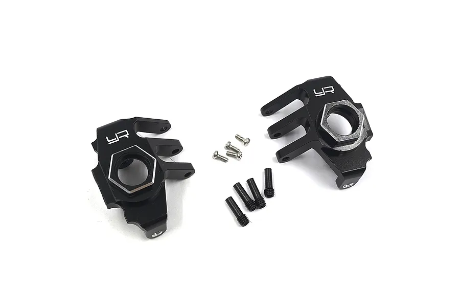 A pair of black aluminium front steering hubs for the Axial RBX10 Ryft by Yeah Racing, shown with included mounting screws on a white background.