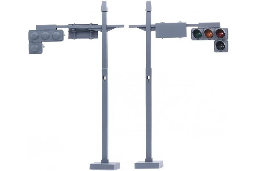 Two grey plastic 1/24 scale traffic signal poles from Fujimi, one showing the back and one showing the front with green, amber, and red lights.