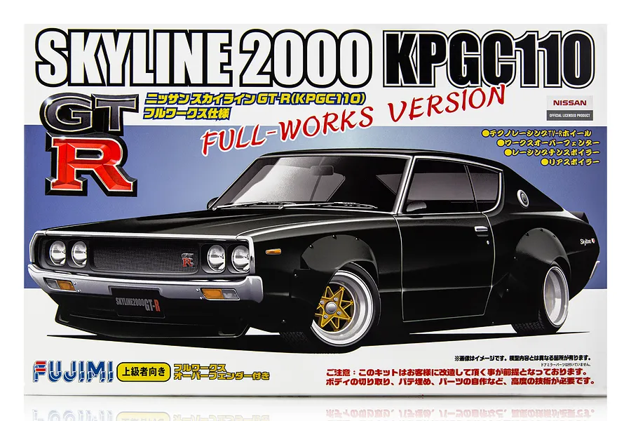 Fujimi 1/24 scale model kit box art for a black Nissan Skyline 2000 GT-R KPGC110 Full-Works Version with wide fender flares.