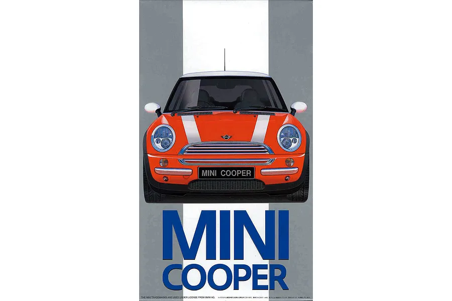 Front view of an orange Mini Cooper model kit box art featuring a white roof and racing stripes.
