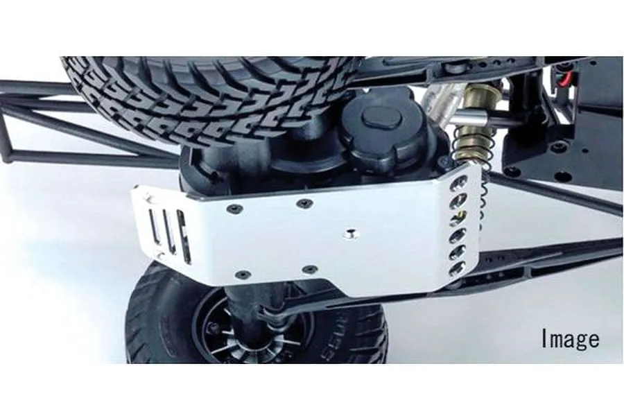 A silver aluminium motor skid plate installed on the underside of an RC vehicle chassis.