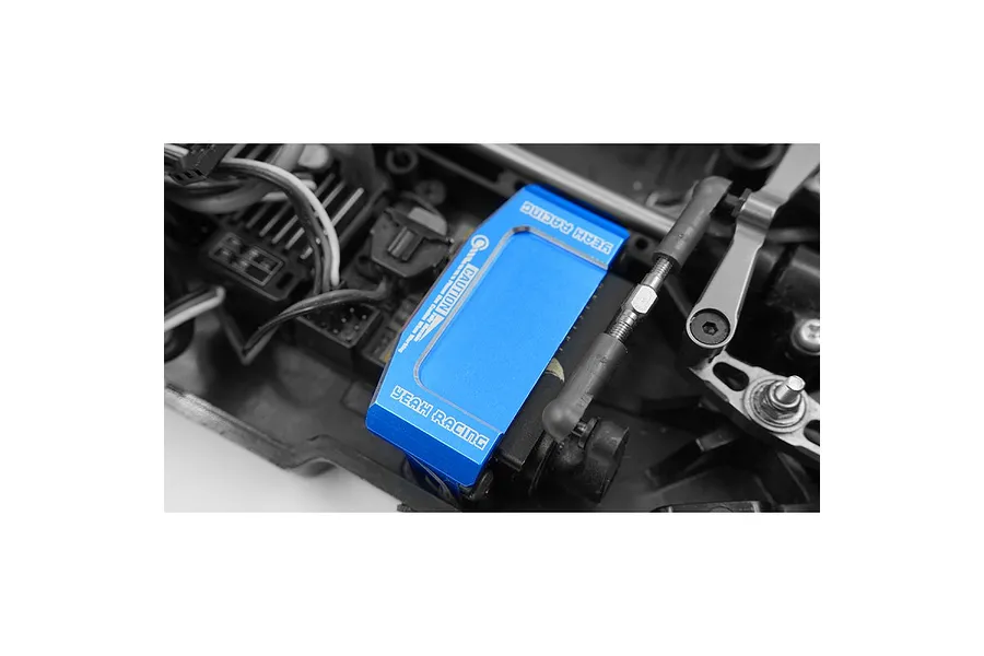 A blue anodized aluminium Yeah Racing servo mount installed in an RC car chassis.