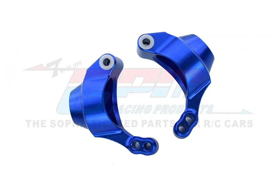 Two blue anodized aluminium rear hub carriers for an RC car, shown against a white background with a faint GPM Racing logo watermark.