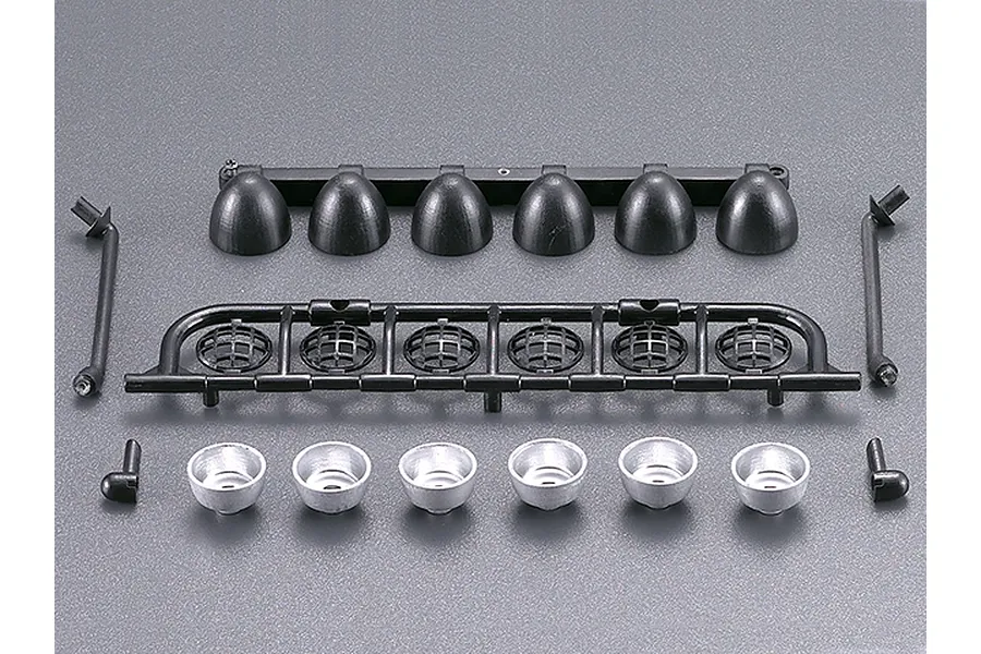 A Killerbody 1/10 scale RC roof light bar kit featuring black plastic light housings, a grille frame, and silver reflector cups on a grey background.