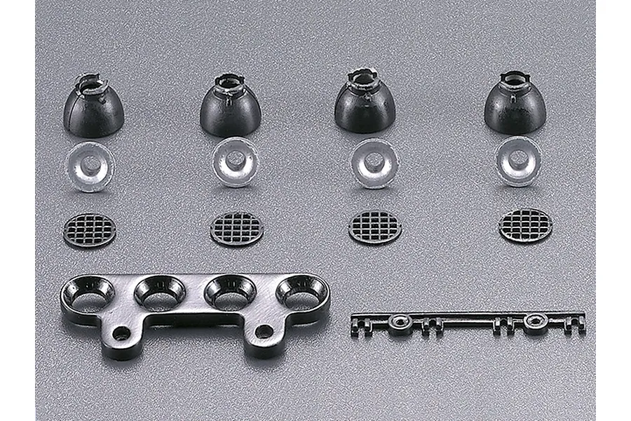 A set of RC light bar components including four black housings, four silver reflectors, four circular grilles, a mounting bracket, and a small plastic sprue.