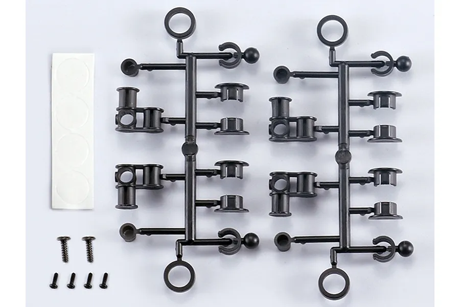 Killerbody Stealth Mounts set including two black plastic parts trees, a strip of four adhesive circles, and six small metal screws on a white background.