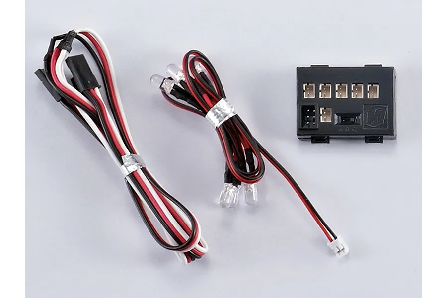 Killerbody LED light system kit including a black control box, wiring harnesses, and multiple LED bulbs on a plain white background.