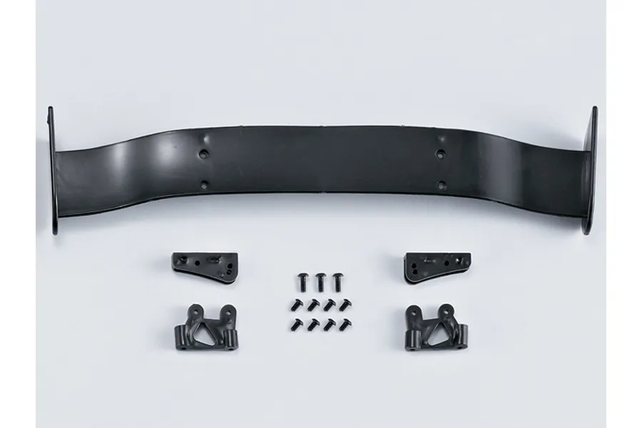 A black RC car rear wing kit including the main wing blade, mounting brackets, and a set of small black screws on a plain white background.