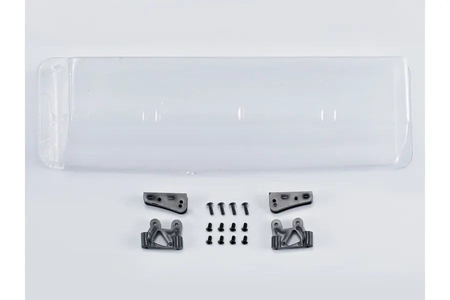 A clear, unpainted RC rear wing with black plastic mounting brackets and a set of small black screws on a white background.