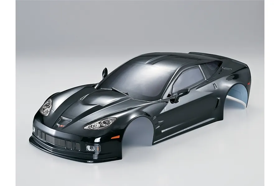 A glossy black 1/10 scale RC Corvette GT2 body shell, pre-painted with detailed headlights and decals on a plain white background.