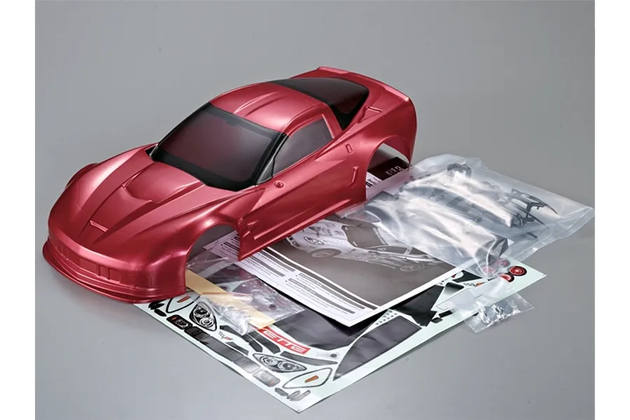 Killerbody 1/10 scale Corvette GT2 RC car body shell in iron oxide red, including decal sheet, instruction manual, and plastic accessory parts.