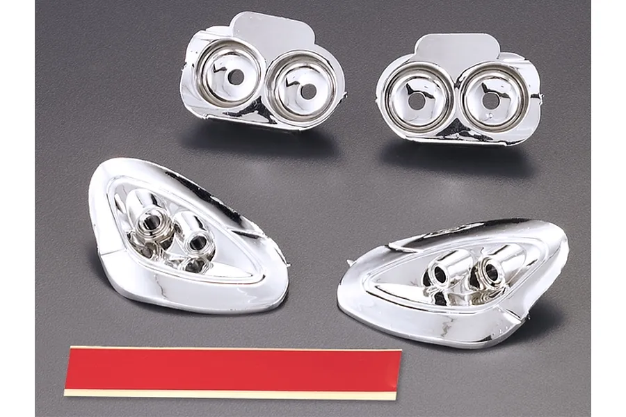 A set of four chrome-finished plastic light buckets for a Killerbody 1/7 Corvette GT2 RC car, including a strip of double-sided adhesive tape.
