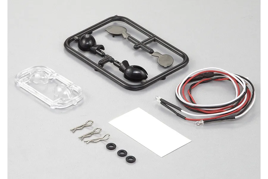 Killerbody 1/10 scale touring car wing mirror set including plastic parts tree, LED light wires, body clips, and small rubber O-rings on a grey background.
