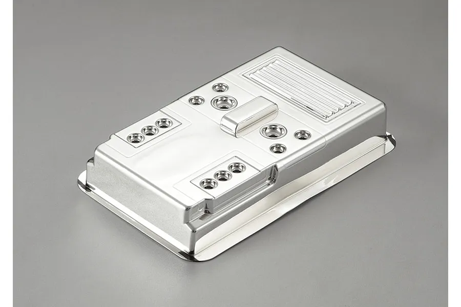 A chrome-plated plastic light bucket and grill assembly for a 1/10 scale RC crawler, featuring multiple circular light housing cutouts.