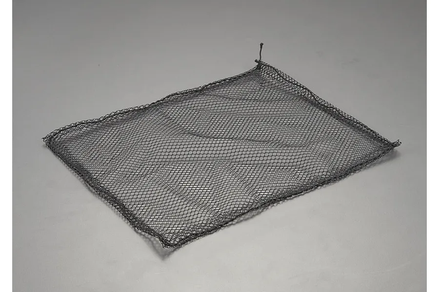 A rectangular black elastic luggage net for RC vehicles, laid flat on a neutral grey surface.